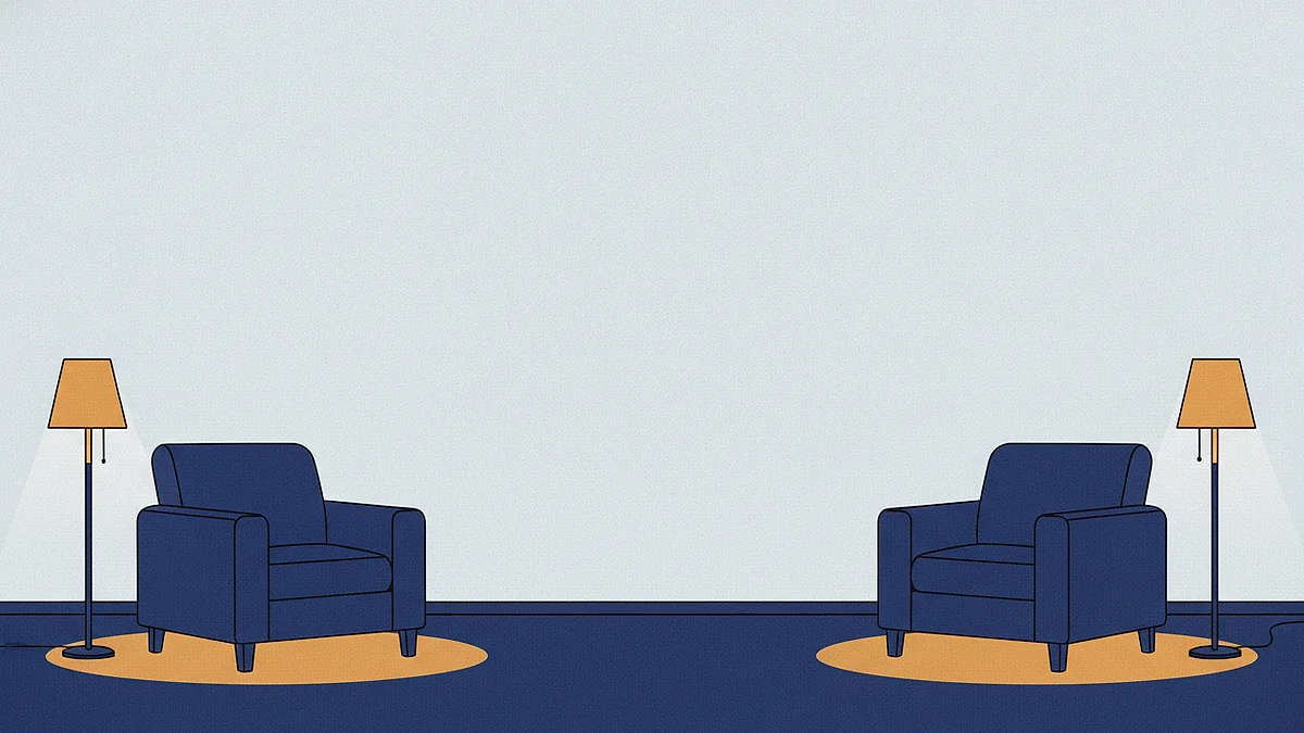 Two armchairs at opposite ends of one room, each with its own lit floor lamp and its own pool of light.