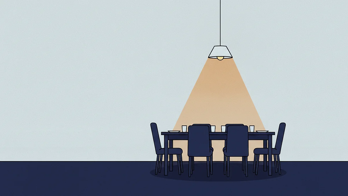 A long table laid for six with every chair pushed in, seen from the doorway of an otherwise empty hall.